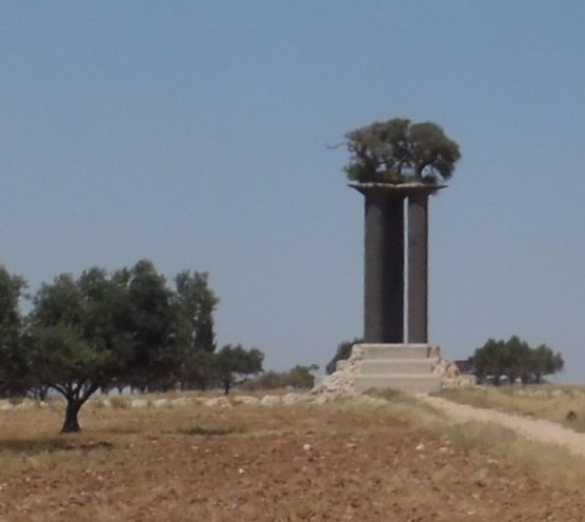 Peace for Israel. This art installation, containing three pillars topped by three olive trees, south of Jerusalem, is an artist's vision of peace for Israel