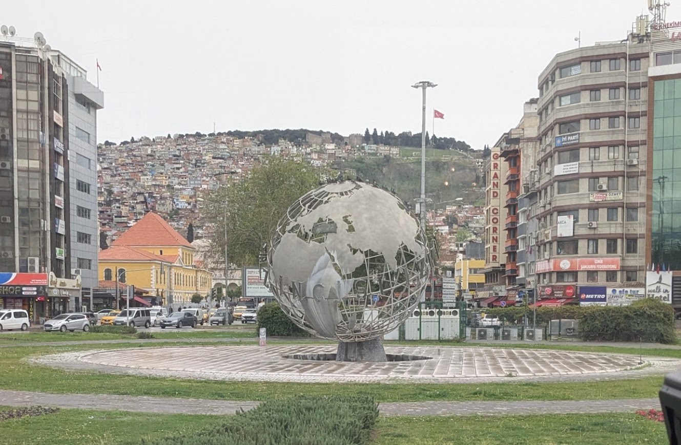 Smyrna today is Izmir, Turkey's third largest city. The old acropolis is atop Mt. Pagus where the flag can be seen.